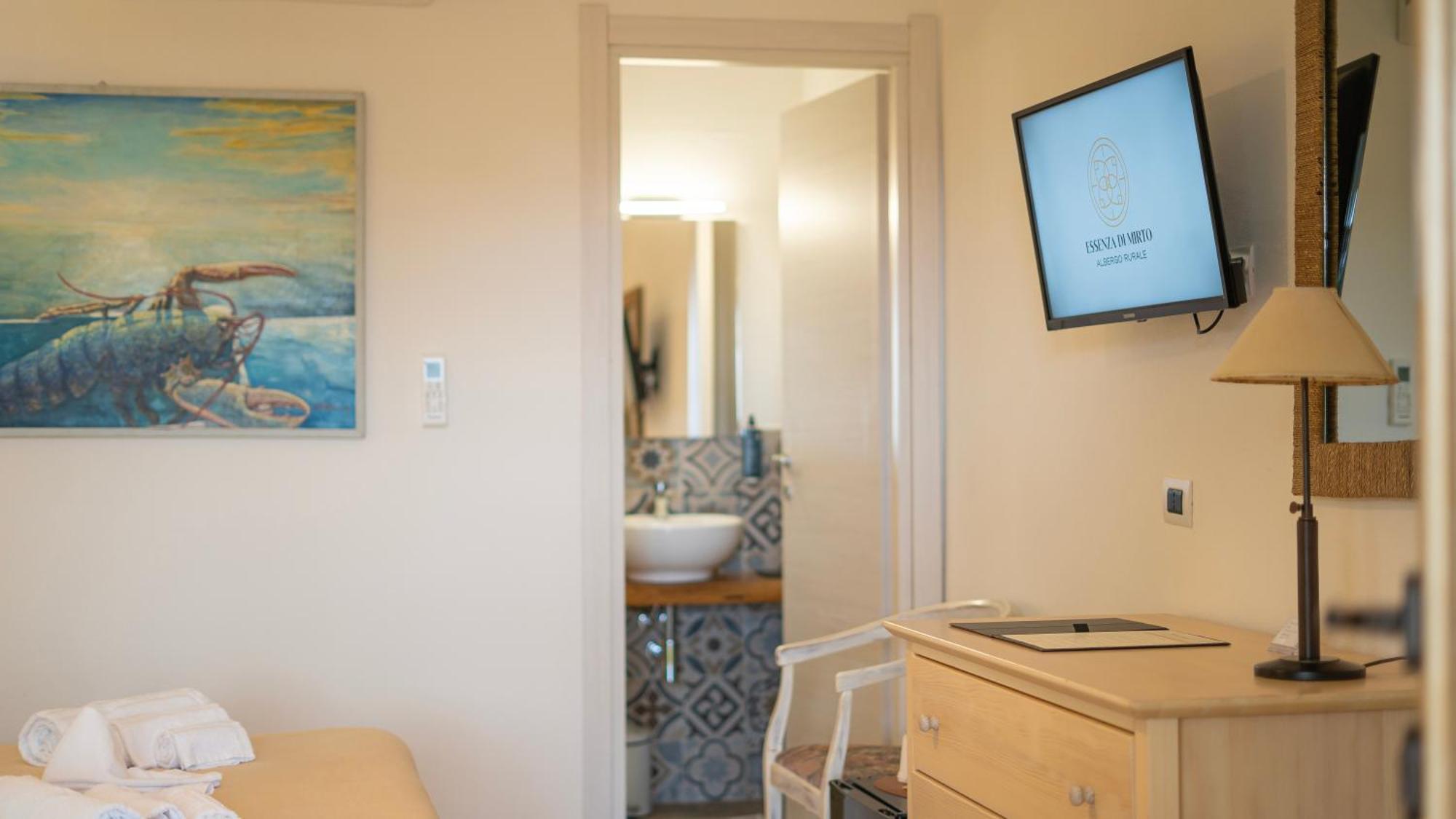 Hotel Essenza Di Mirto La Caletta Værelse billede